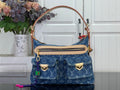 Blue monogram denim handbag with top handles and front flap pocket