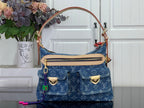 Blue monogram denim handbag with top handles and front flap pocket