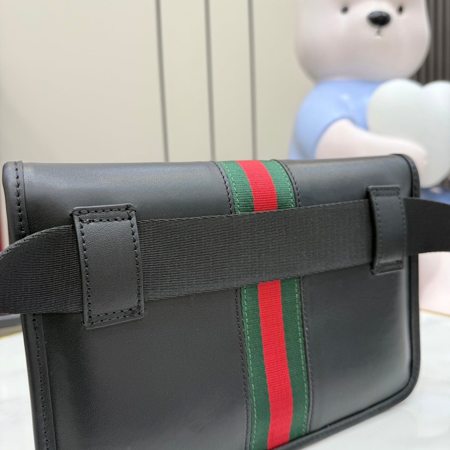 Gucci crossbody bag in dark leather with green and red web stripe and front flap