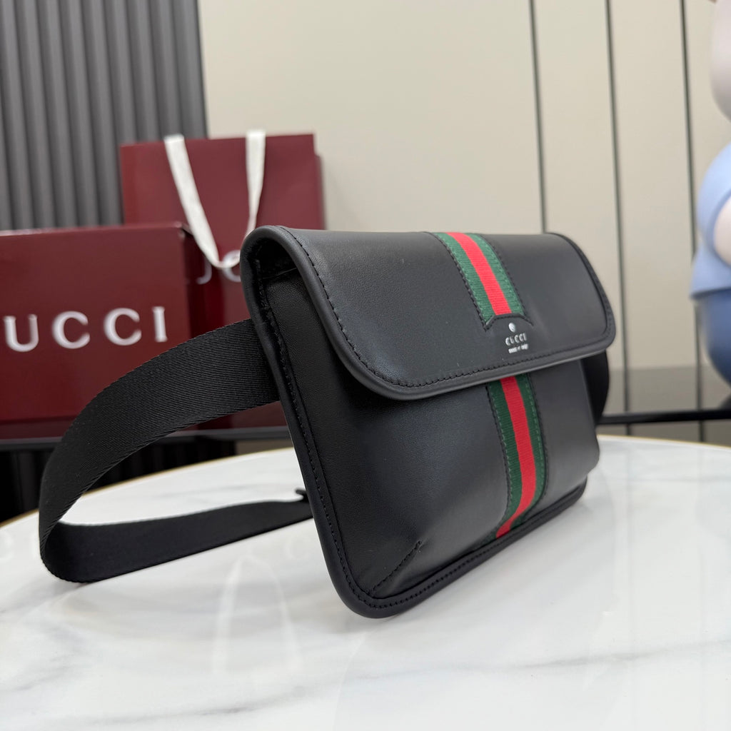 Gucci black crossbody bag with flap, green-red stripe, and wide adjustable strap
