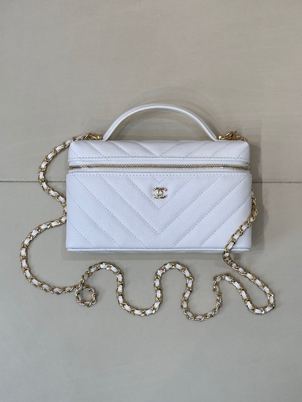 Quilted light blue mini handbag with gold chain and clear top handle