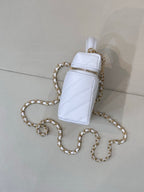 Light blue quilted mini pouch bag with gold chain and zip top