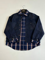 Denim jacket with plaid lining at collar, long sleeves, button-front and chest pockets