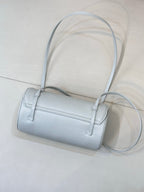 Light blue Chanel handbag with two top straps and long crossbody strap, front logo