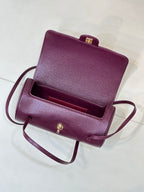 Burgundy leather mini bag open top with inner compartment and gold hardware
