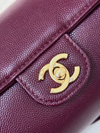 Burgundy leather mini bag gold CC clasp on textured flap panel