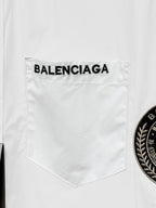 Balenciaga shirt chest pocket, white with printed BALENCIAGA lettering above the pocket.