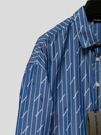 Blue button-up shirt with pointed collar and vertical pinstripe logo pattern