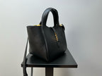 YSL mini tote bag with textured leather finish, top handle, and side hardware accents
