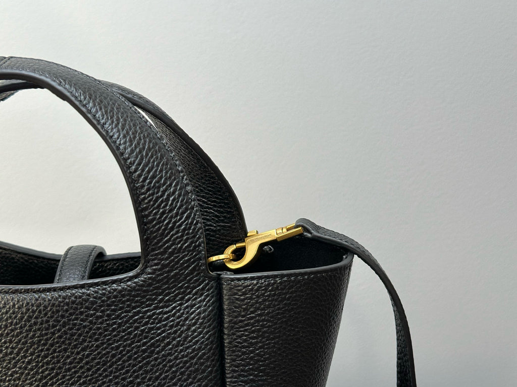 YSL tote bag strap and gold-tone ring hardware with textured leather texture