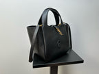 YSL tote bag with top handles and gold-tone logo charm detail