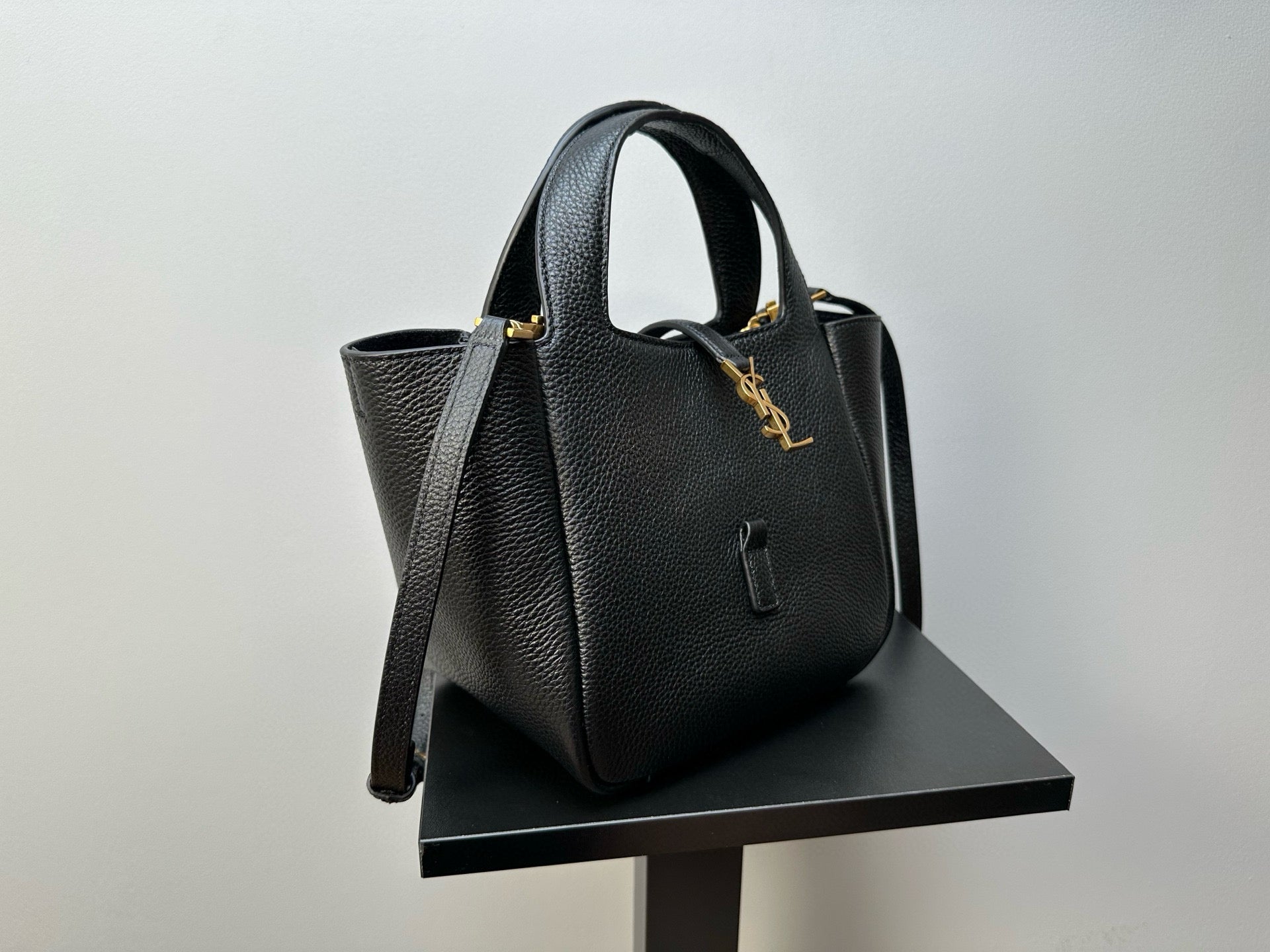 YSL tote bag with top handles and gold-tone logo charm detail