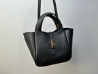 YSL tote bag front view with top handles, structured silhouette, and gold-tone logo charm