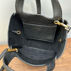 YSL mini leather tote bag interior view, black lining with pocket and gold hardware