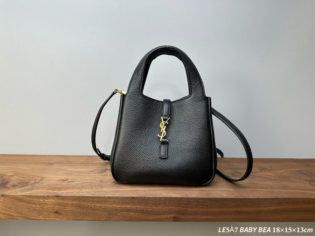 Black leather mini handbag with gold YSL logo, top handle and crossbody strap