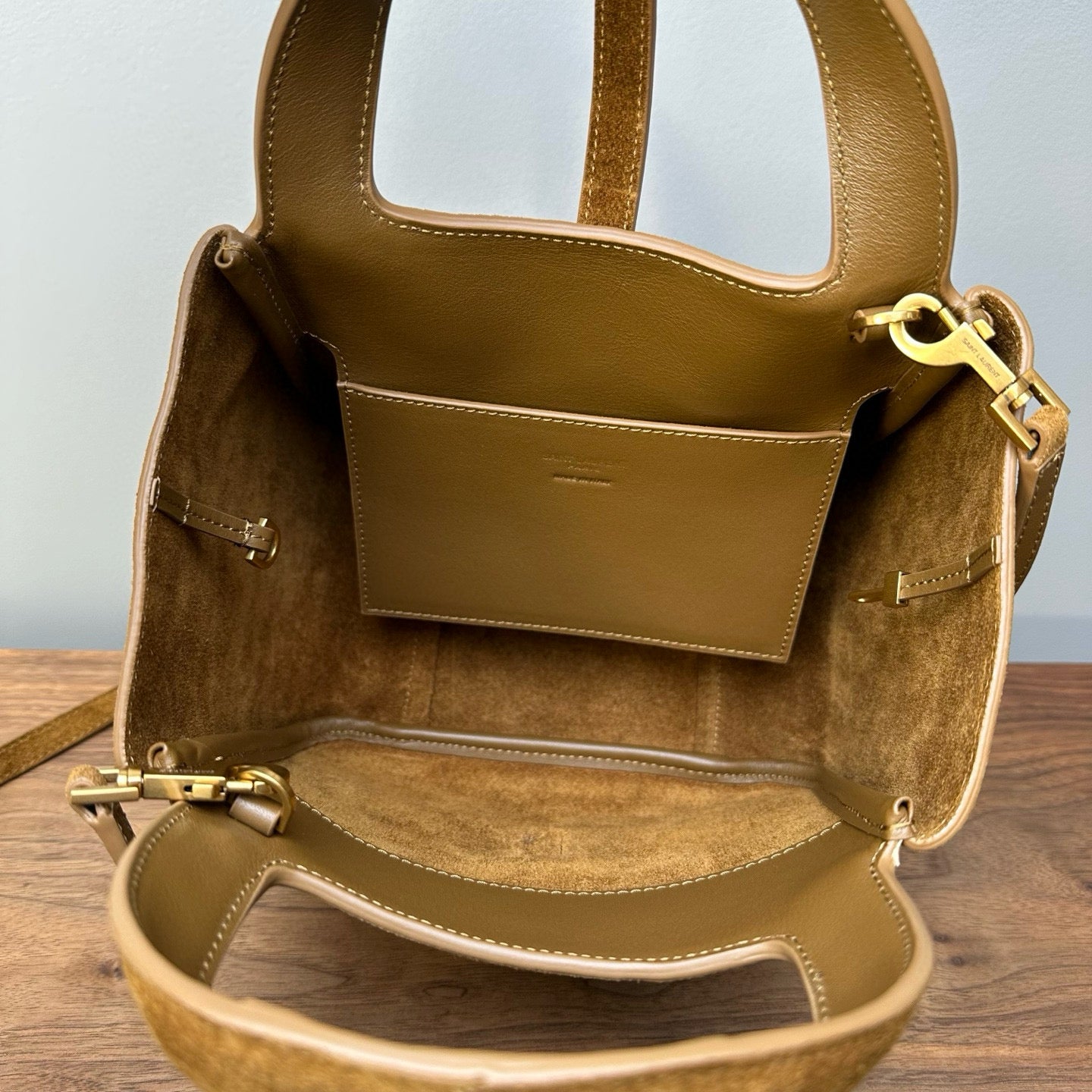 Suede mini tote bag interior with center pocket, top handle and strap, tan