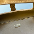 Gold-brown leather bag interior with Saint Laurent Paris branding stamp