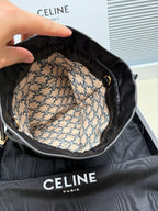 Black leather drawstring bag interior with patterned lining and gold-toned eyelets