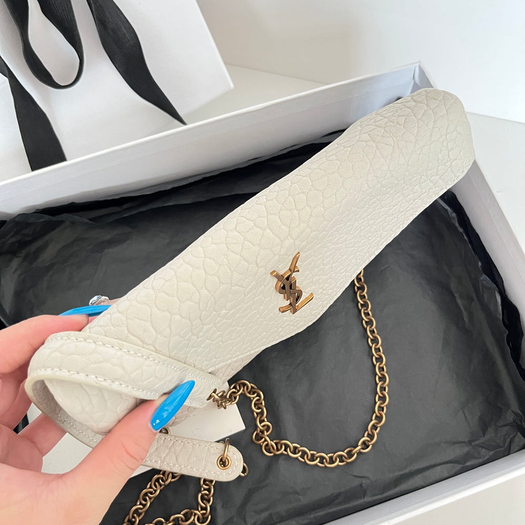 Light off-white textured shoulder bag with flap, gold-tone chain strap, and YSL emblem