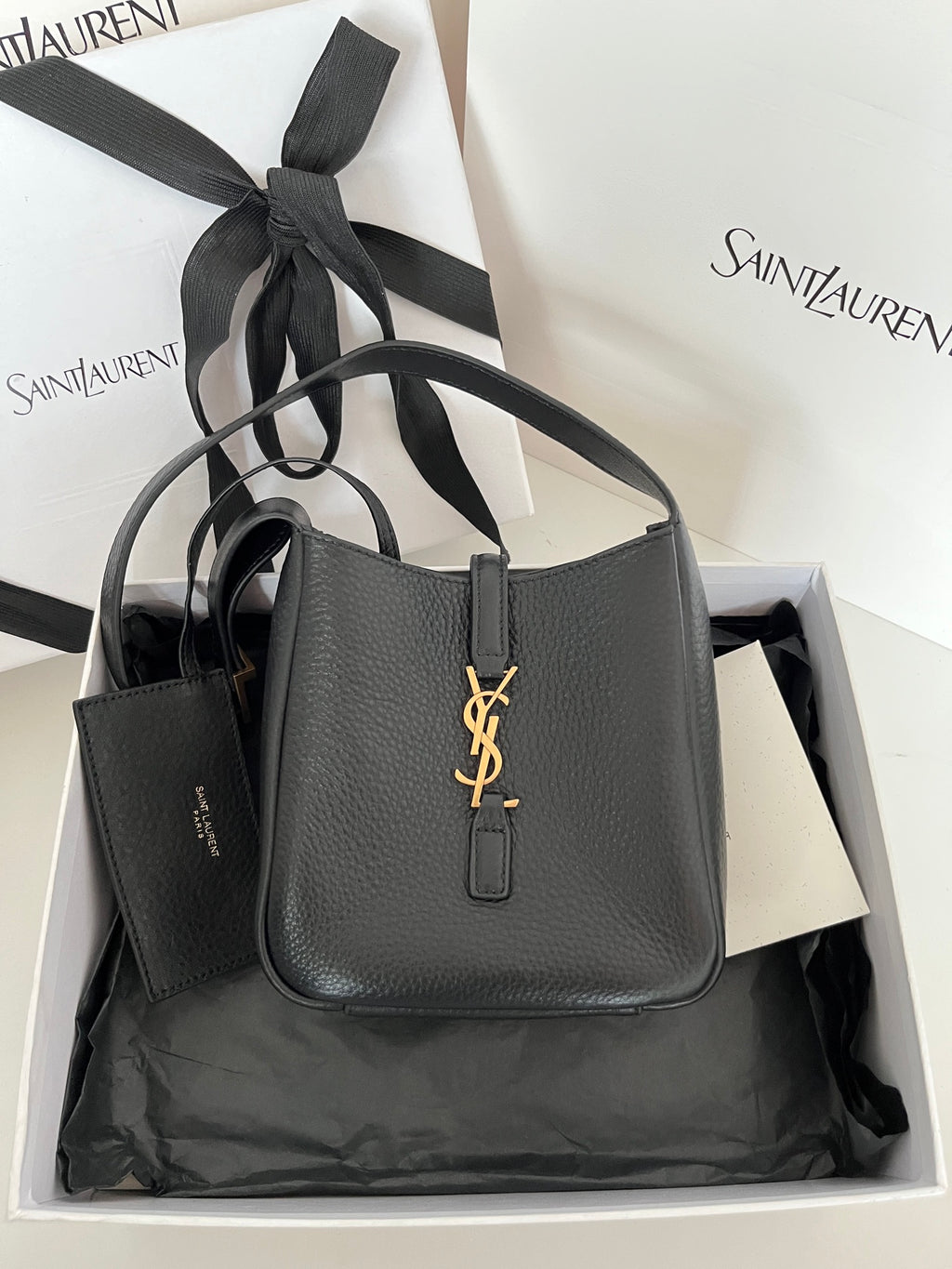 YSL bag, black pebbled leather with gold monogram front and top handles