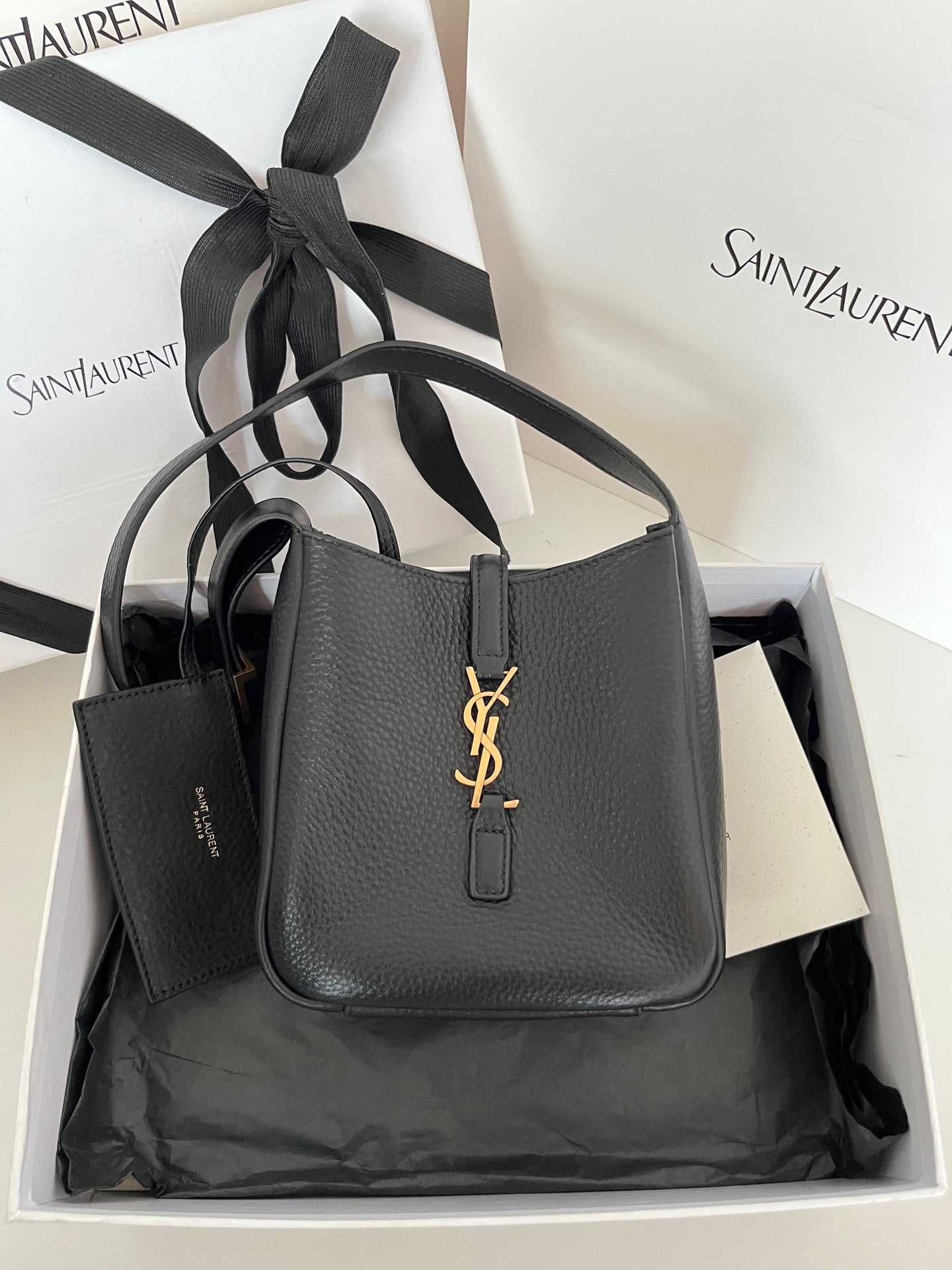 YSL bag, black pebbled leather with gold monogram front and top handles
