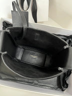 YSL bag interior view, black leather lining with center pocket panel