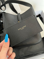 YSL bag front with stitched panel, black pebbled leather and top handle