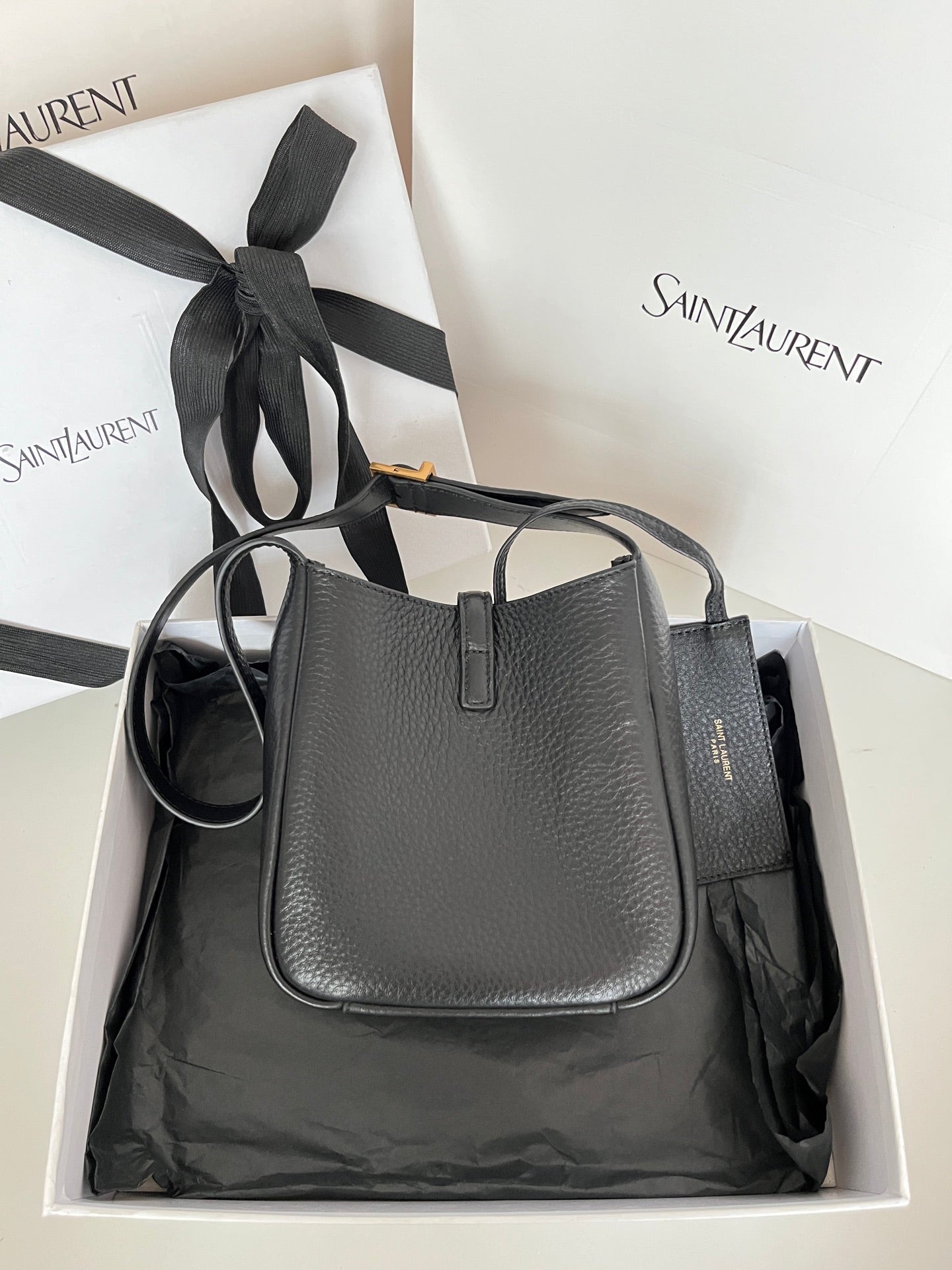 YSL bag, black pebbled leather with top handle and front monogram