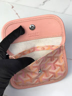Pink and beige Goyard-style canvas interior pocket with logo patch
