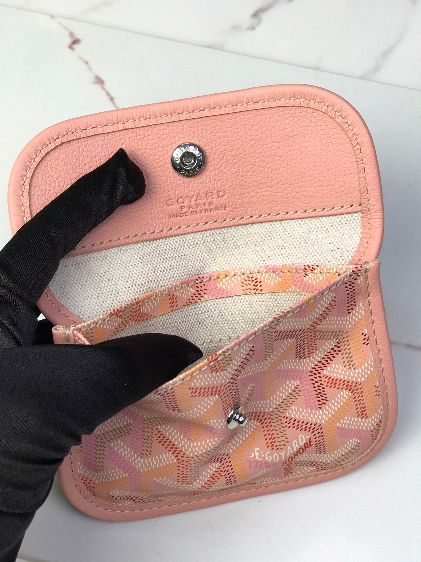 Pink and beige Goyard-style canvas interior pocket with logo patch