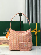 Pink Goyard-style canvas tote bag with top handle and front flap pocket