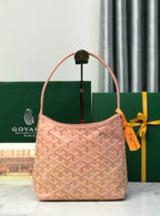 Pink Goyard-style canvas tote bag with curved handles and hanging tag