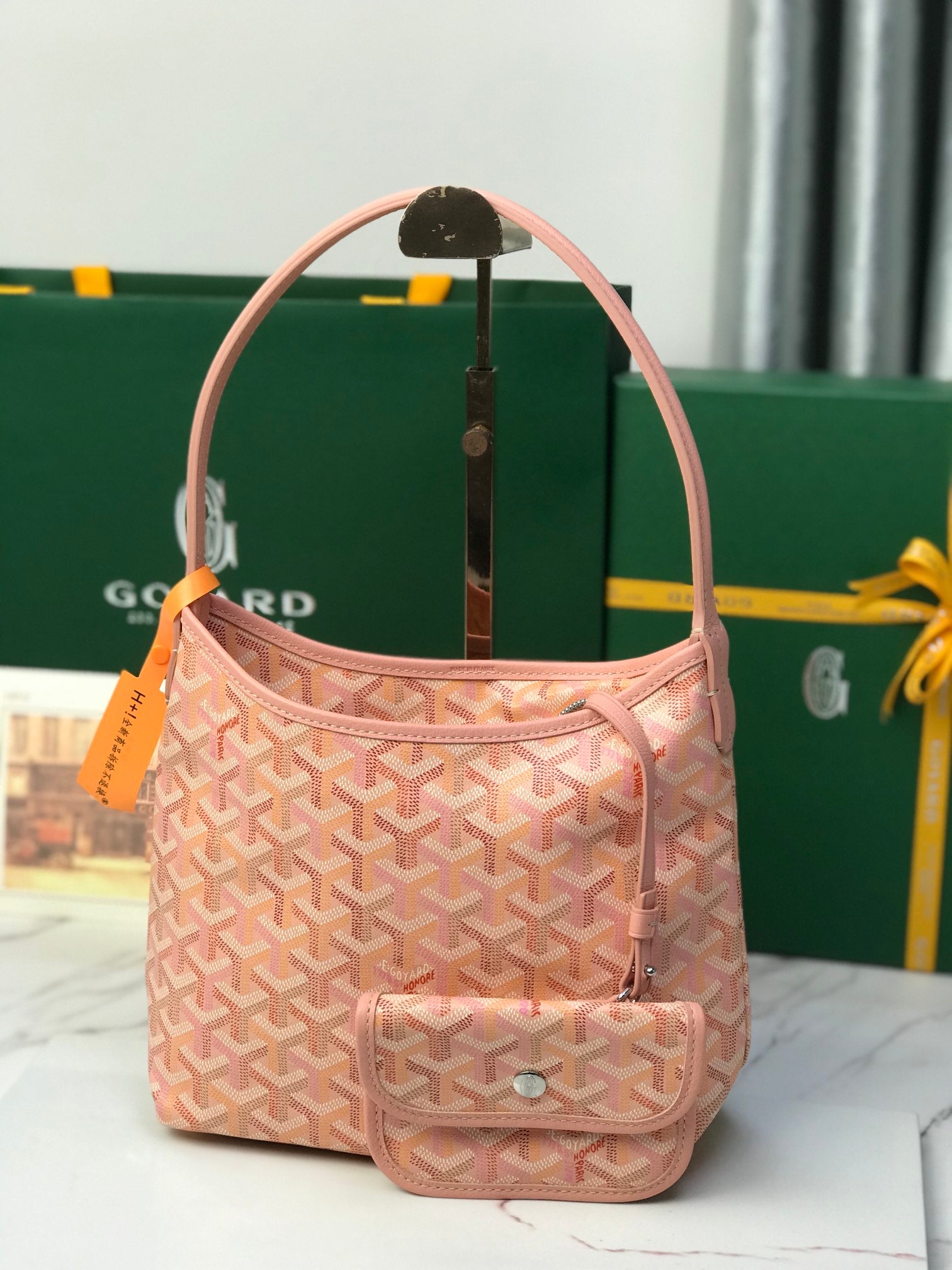 Pink Goyard-style canvas handbag with top handle and front flap pocket