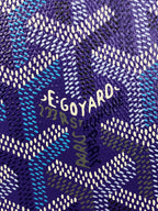 Close-up of purple Goyard patterned fabric with 'GOYARD' lettering