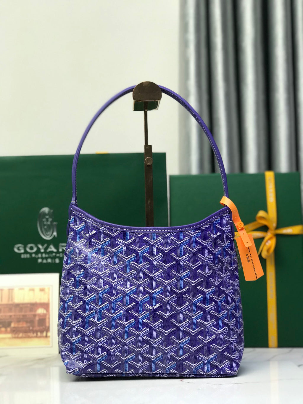 Purple patterned Goyard tote bag with top handles and front flap pocket