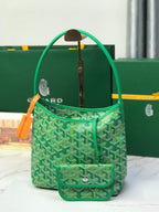 Green Goyard tote bag with repeating pattern and front flap pocket, plus pouch.