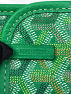 Green Goyard patterned interior lining with leather trim and label patch at edge.