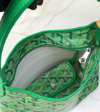 Green Goyard tote interior with zip pocket and repeating monogram lining.