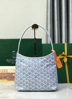 Goyard small bucket bag in light blue with curved top handles and orange tag