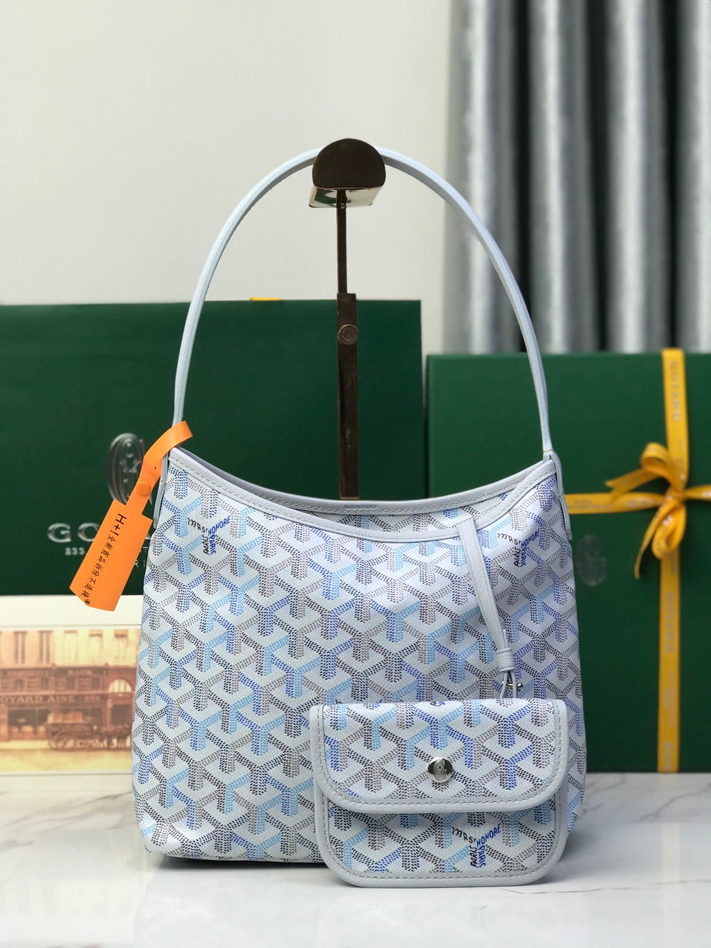 Goyard small bucket bag in light blue with Goyardine pattern and top handles