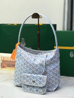 Goyard small bucket bag with front flap pocket and light blue Goyardine pattern
