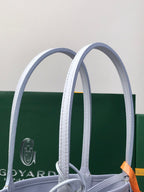 Goyard tote bag handles and structured top opening with patterned body