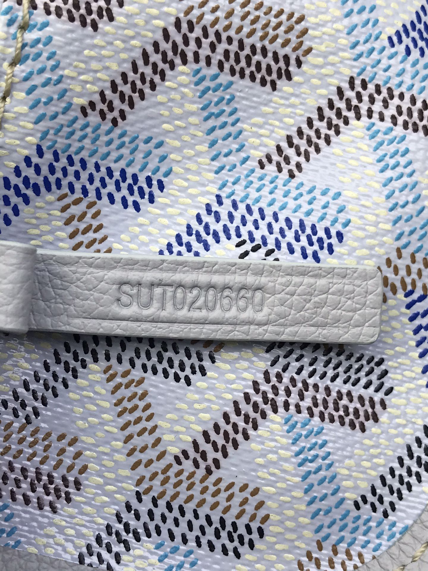 Goyard monogram patterned pouch with fabric tag and embossed code label
