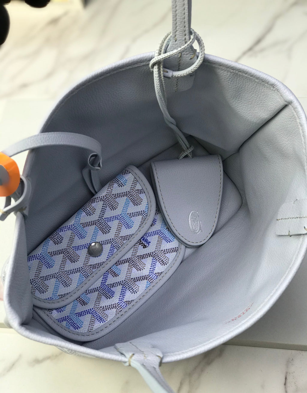 Goyard tote interior with small matching pouch and top pull tab loop
