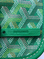 Green leather trim with stamped logo on patterned canvas