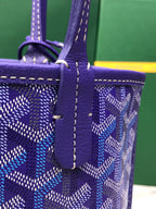 Goyard purple monogram tote bag with front tab strap and stitched edging