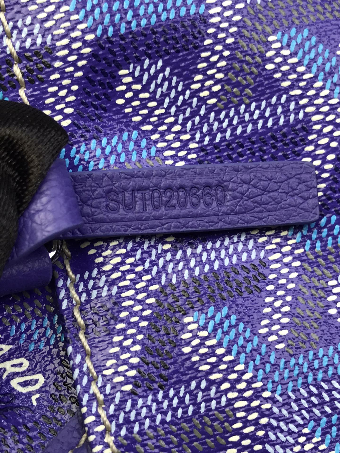 Goyard purple monogram pouch interior with SUPACOLOR-style fabric tab