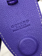 Goyard purple leather tote panel with embossed logo and curved pocket detail