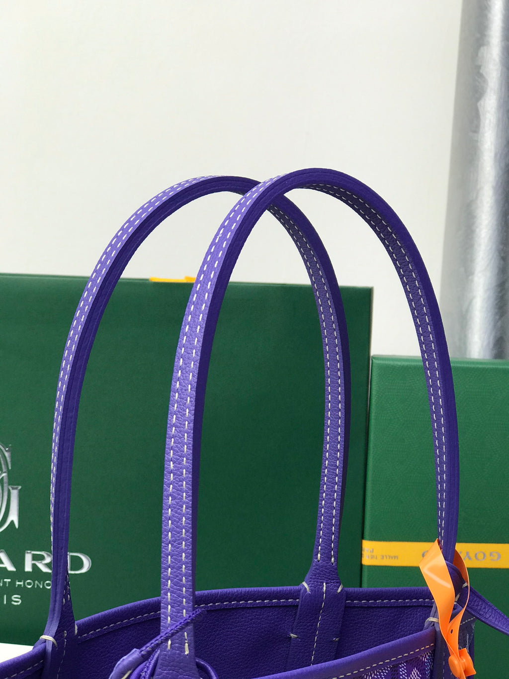 Goyard purple tote bag showing leather handles and top opening