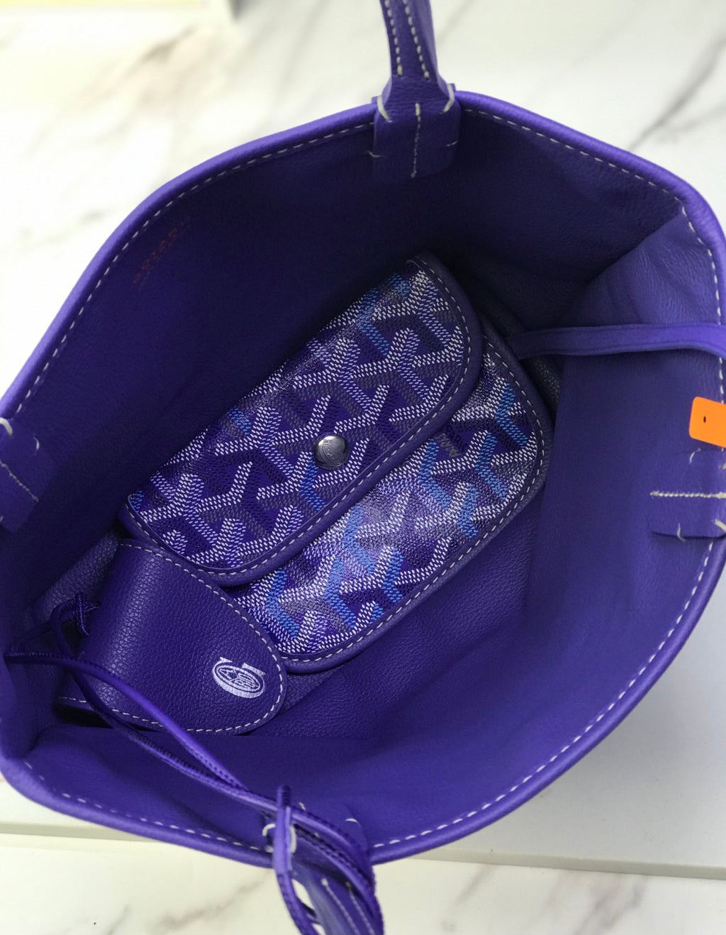 Goyard purple tote bag interior with monogram wristlet pouch and pocket